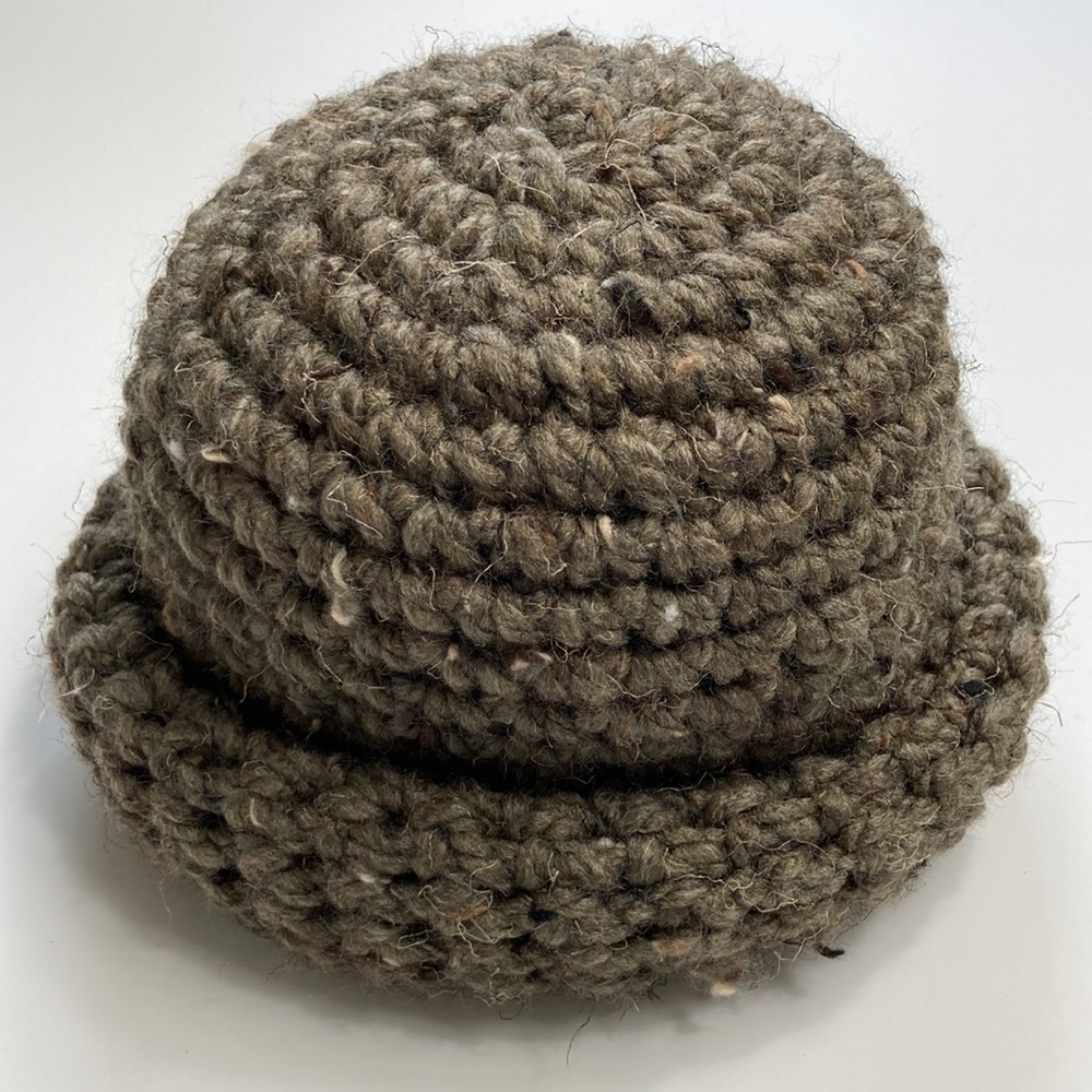 Hand made crocheted beanie NWOT. Dark Green and very stretchy!!